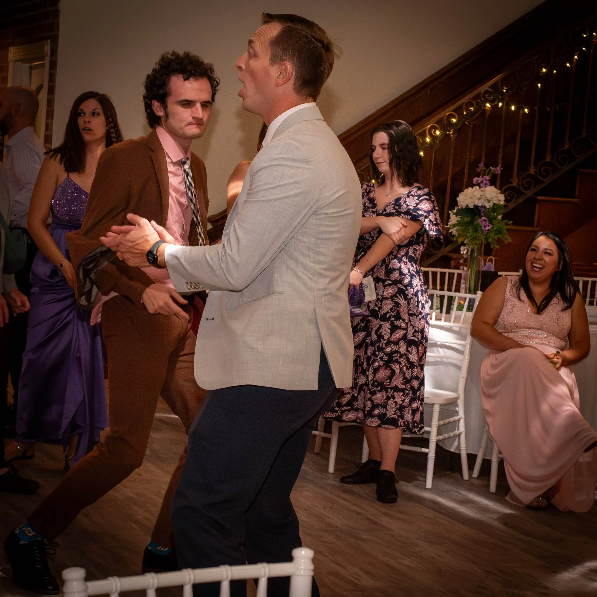 Guests moving onto the dance floor under string lights