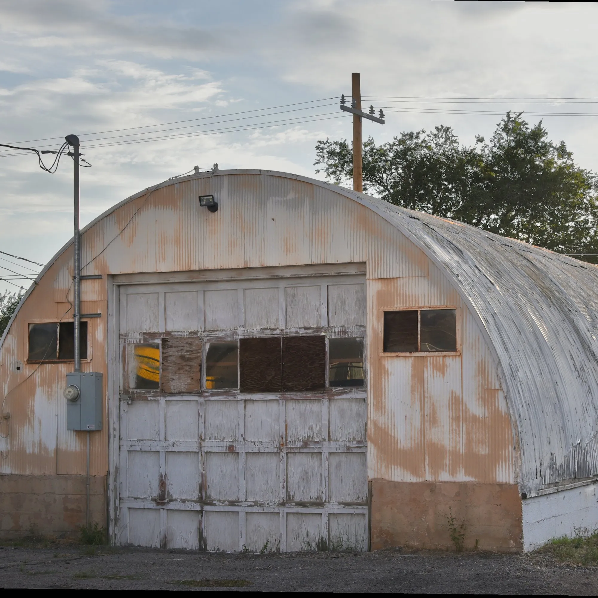 Rusting quonset hut garage on a grey afternoon